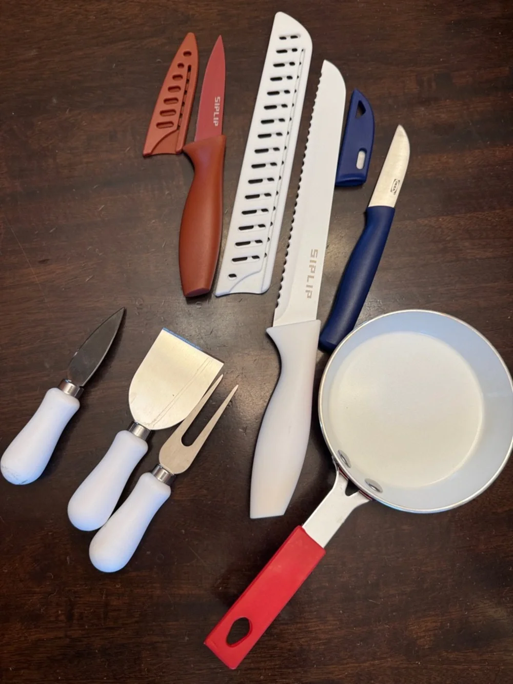 Assorted Kitchen Knife and Utensil Set with Red-Handled Mini Skillet